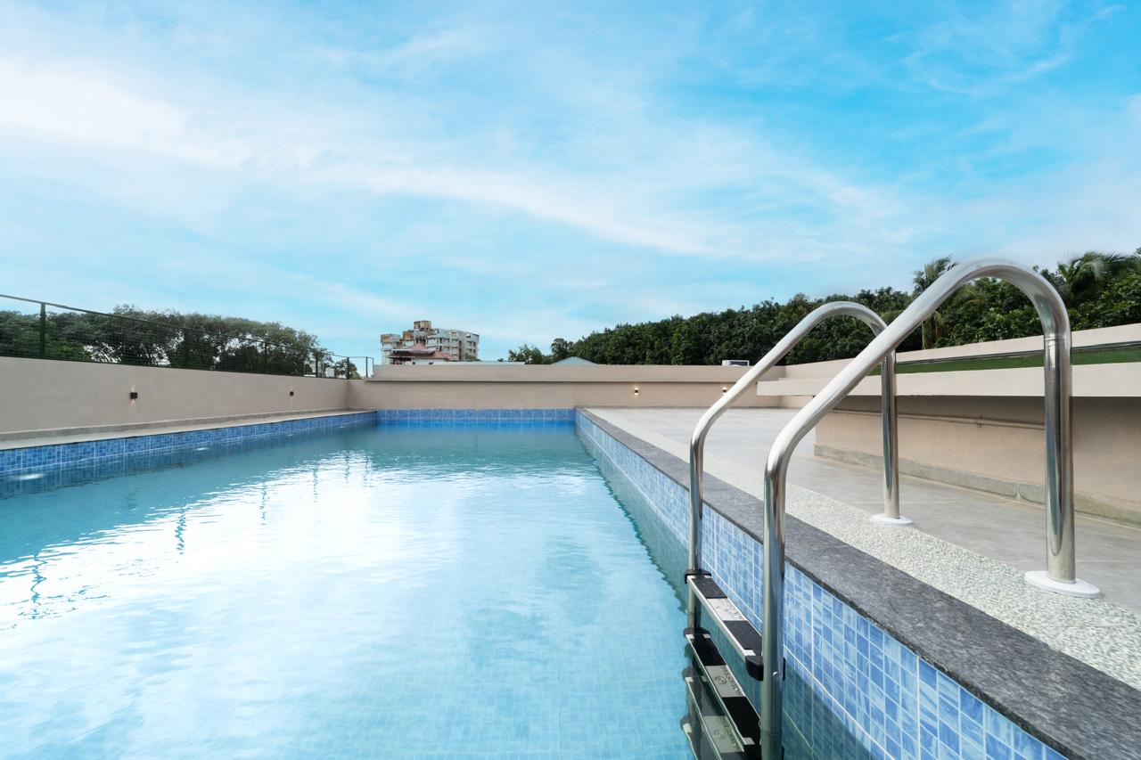 Rooftop swimming pool deck with open sky views — Exterior work by Alpha Design Studio
