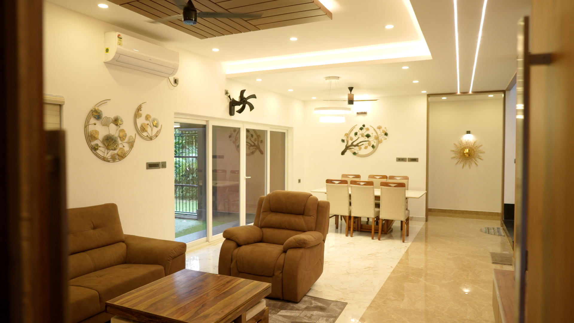 Open living and dining with wood-slat ceiling — Interior work by Alpha Design Studio