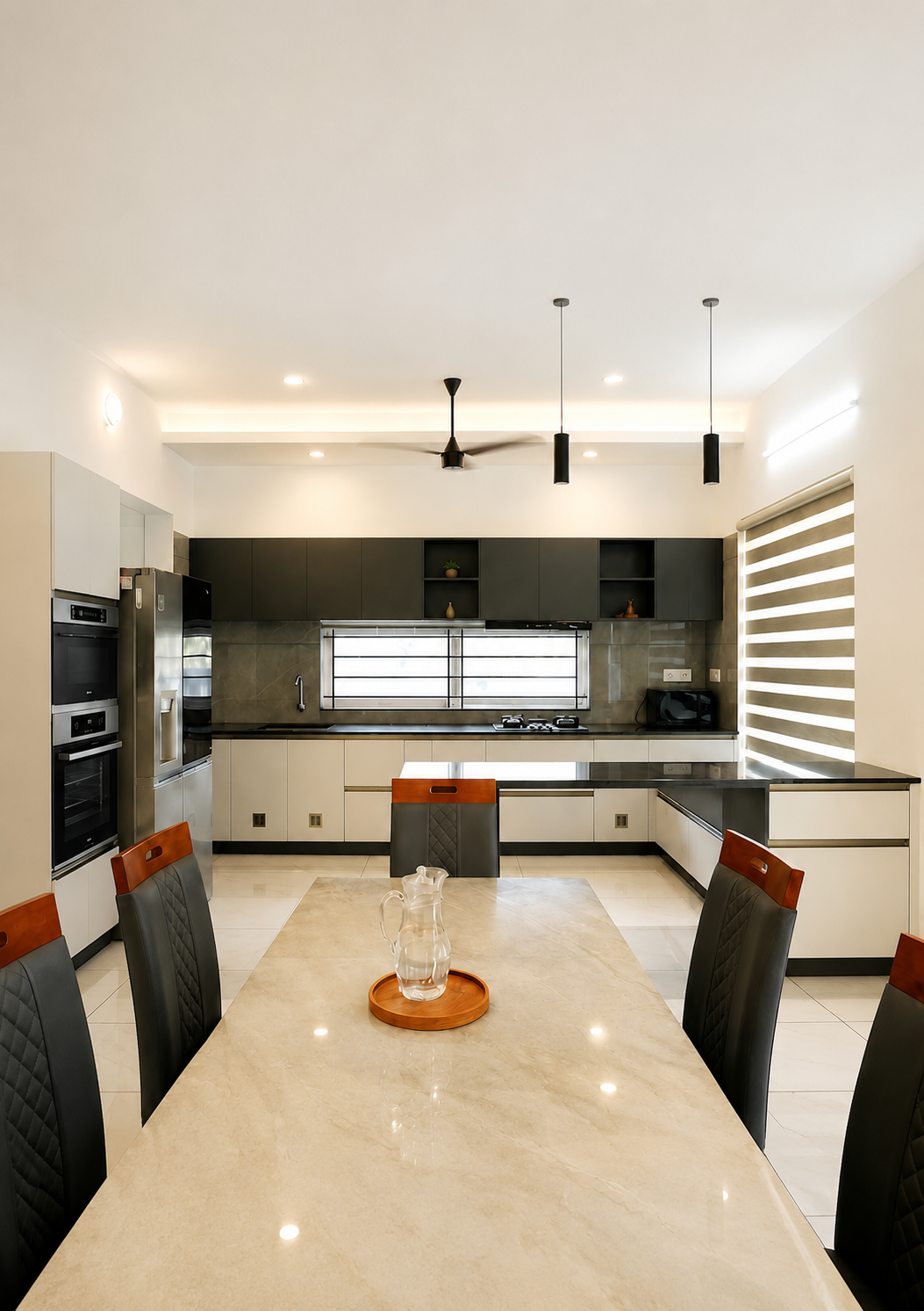 Modern kitchen with dining island and pendant lighting — Interior work by Alpha Design Studio