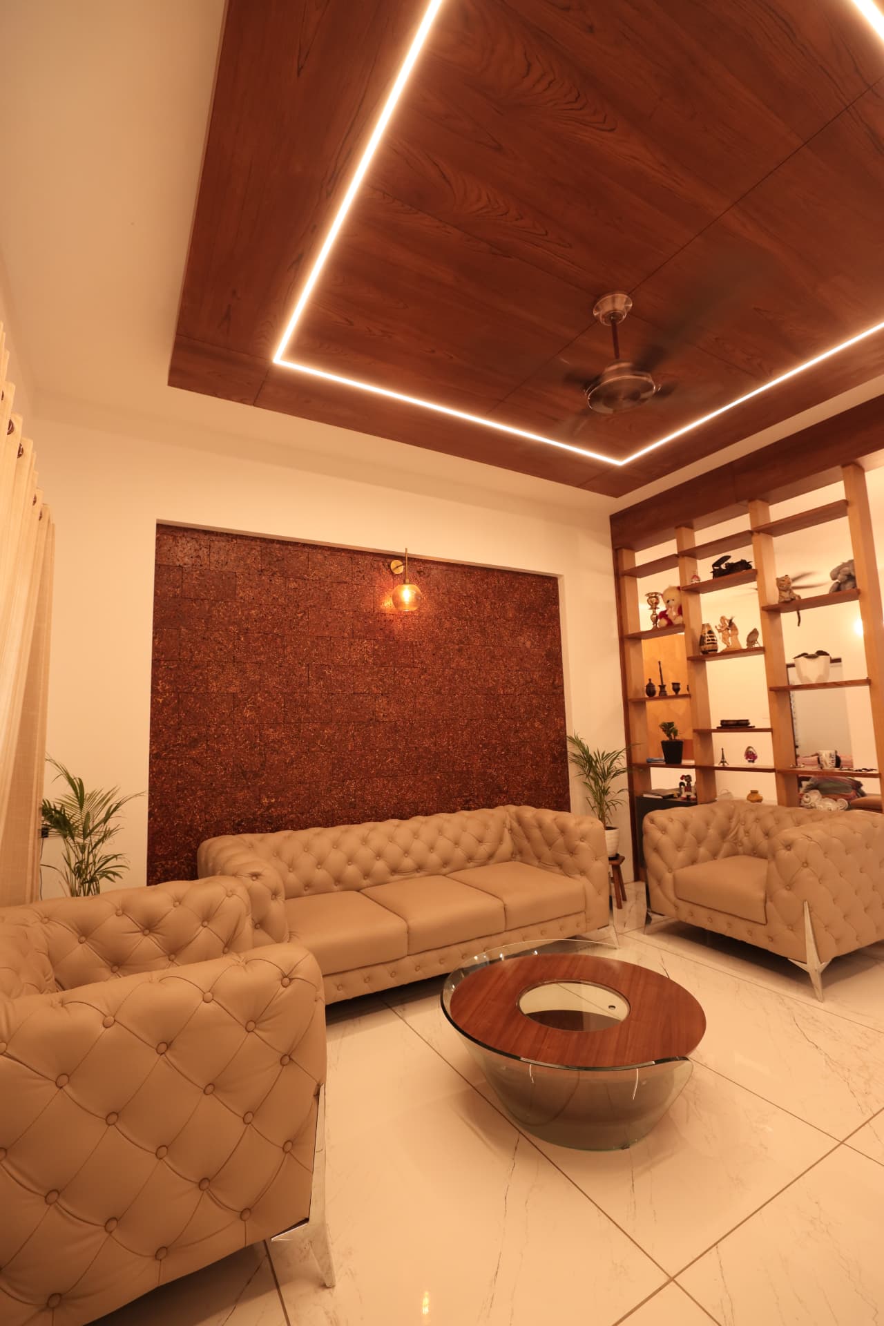 Formal living room with cork feature wall and wood ceiling — Interior work by Alpha Design Studio